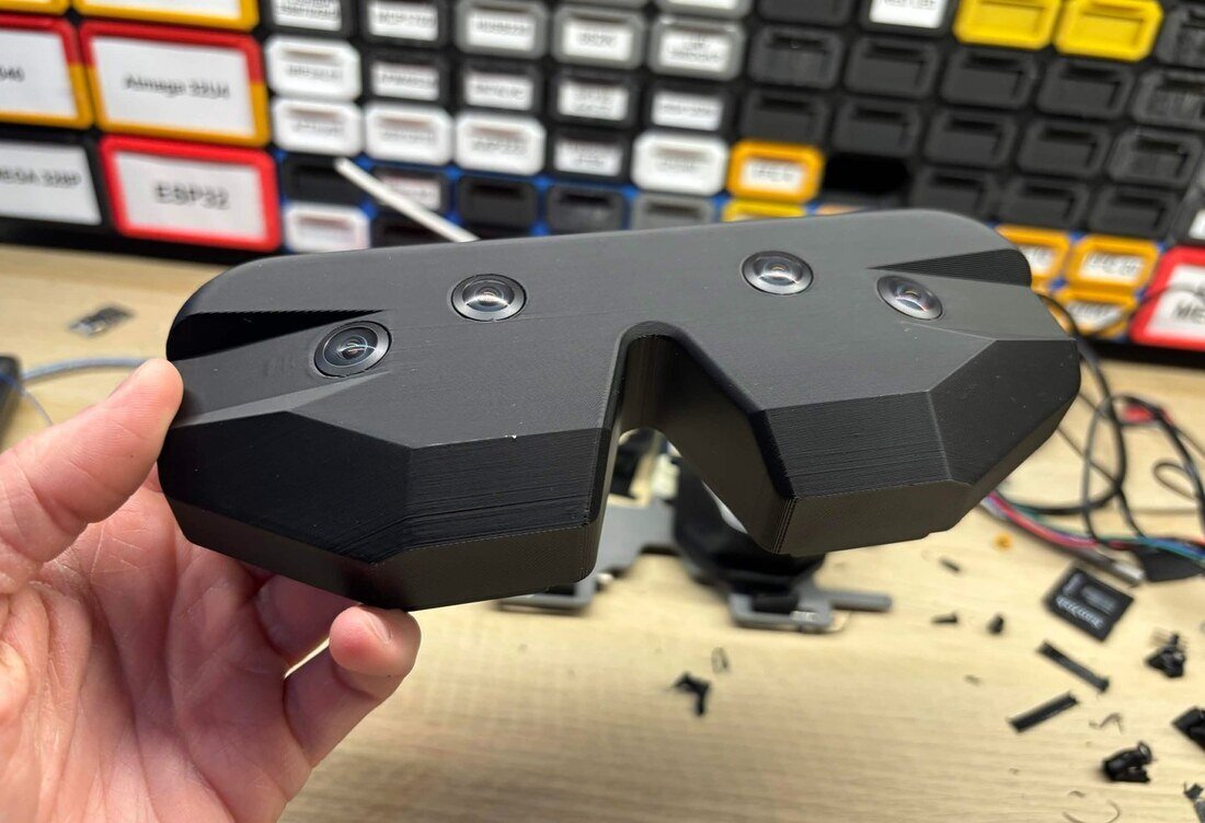 A Vector Gear prototype held up in front of the bench.
